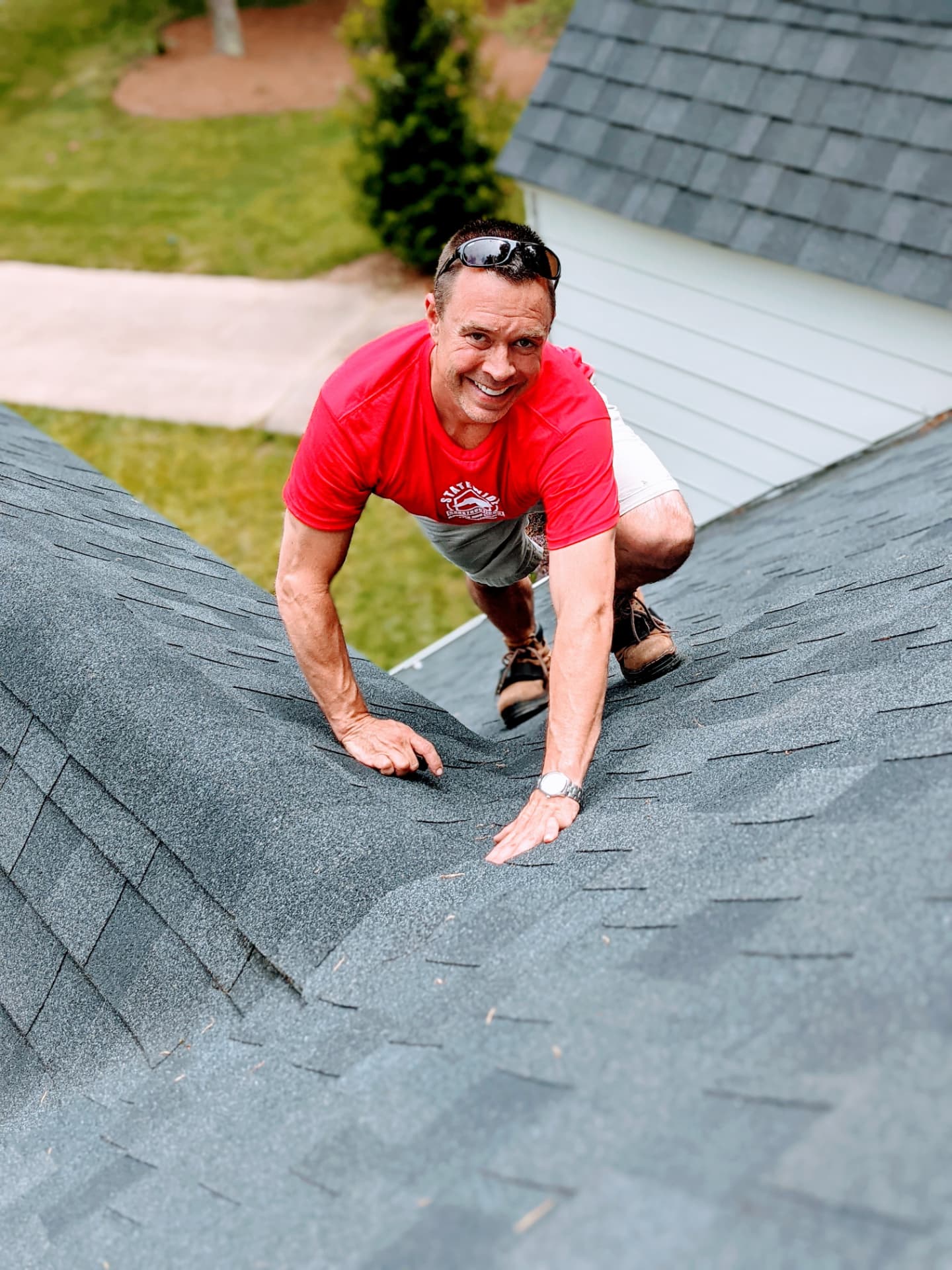 Clay Curtis working a shingle roofline on a Statewide Construction project